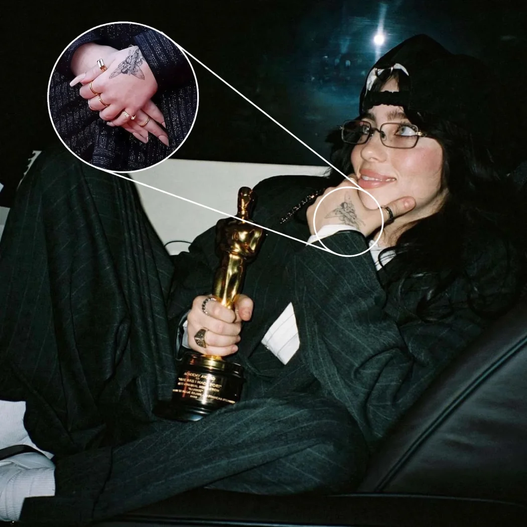 Billie Eilish holding Oscar trophy showing fairy hand tattoo with close-up inset detail
