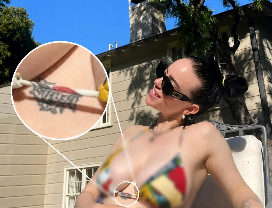 Close-up of Billie Eilish's hidden chest tattoo highlighted with a zoomed-in inset.