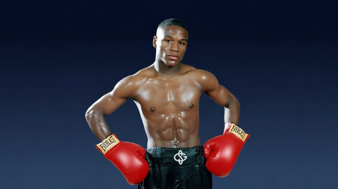 Floyd Mayweather with championship belts and PPV cash imagery.