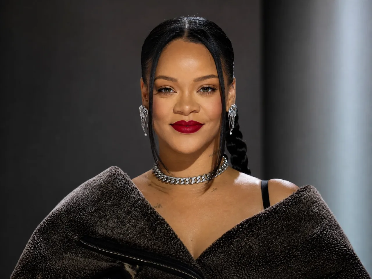 Beauty palette and fashion icons symbolizing Rihanna's Fenty Beauty and Savage X Fenty ownership